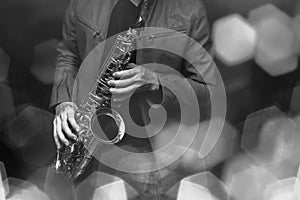 Jazz saxophone player in performance on the stage. color filter