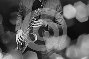 Jazz saxophone player in performance on the stage. color filter