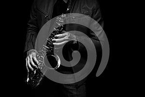 Jazz saxophone player on the stage black and white color