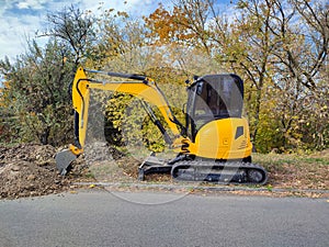 JCB digger or excavator performs excavation work outdoors