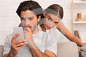 Jealous Wife Spying On Husband While He Texting On Phone Indoor
