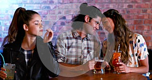 Jealous woman looking at couple flirting with each other