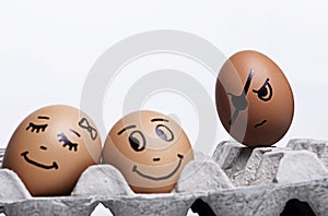 A Jealousy stranger egg looking on happy loving egg couple photo