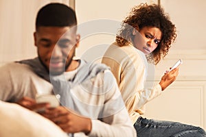 Jealousy. Woman suspecting husband cheating on her photo