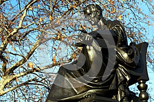 Jean Jacques Rousseau portrait statue in Geneva, Switzerland in winter