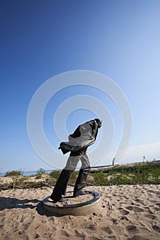 Jean Paul Sartre statue on dunes