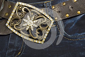 Jeans with a belt decorated with rhinestones photo