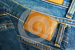 Jeans with brown leather label closeup