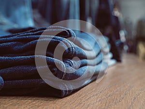 Jeans fashion store on shelf. Casual denim clothing. Concept of