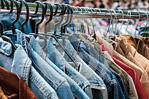 Jeans jackets and retro shirts on second hand market / flea mar