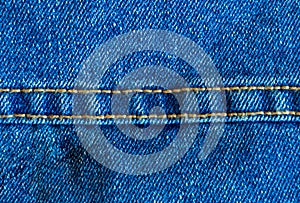 Jeans material with the stitched seam