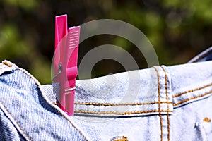 Jeans pegged on a washing line