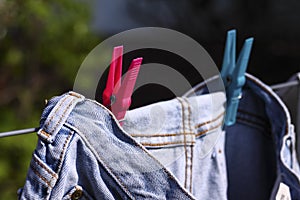 Jeans pegged on a washing line