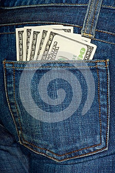 Jeans pocket with $100 bills