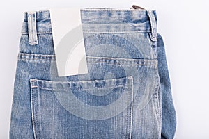 Jeans with price tag isolated on white background