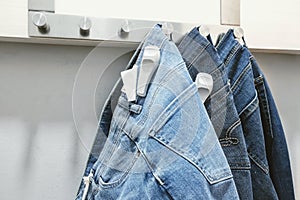 Jeans in a shop fitting room of store