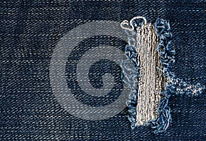 Jeans texture or background denim blue with tear