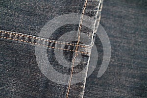 Jeans texture and stitches background. Close-up blue denim fabric