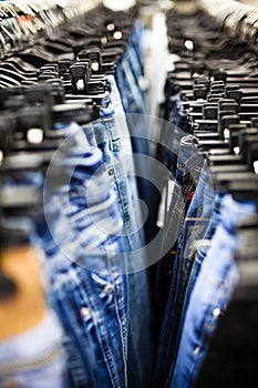 Jeans and trousers on hangers