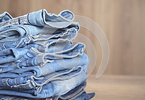 Jeans on the wooden background