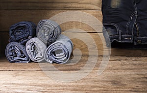 Jeans on a wooden table background