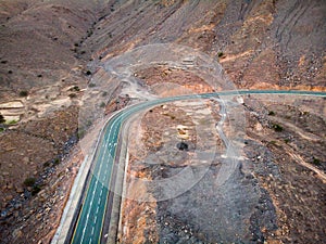 Jebel Jais mountain desert road surrounded by sandstones in Ras al Khaimah aerial view