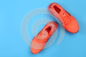 Jeddah Saudi Arabia July 22 2020 Pair of sport shoes on colorful background.  copy space. Overhead shot of running shoes. Top view