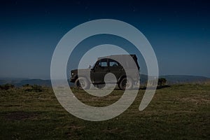 Jeep in the background of the starry sky