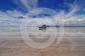 Jeep reflected in Salar de Uyuni photo