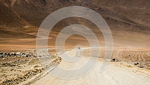 Jeep riding on road of Bolivian desert