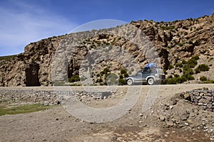 Jeep on the road. Off-road tour on the salt flat Salar de Uyuni in Bolivia