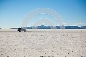 Jeep on Salar de Uyuni, Bolivia photo