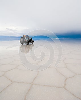 Jeep in the salt lake salar de uyuni