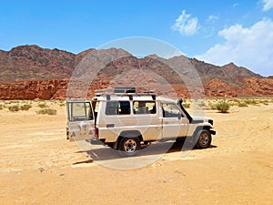 Jeep stopped in the desert of the Sinai Peninsula. Red Sea coast and adventure routes through the Dahab desert