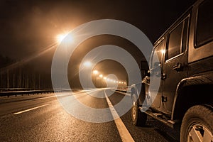 Jeep Wrangler night on a deserted road in the Leningrad region