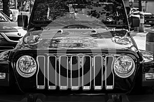 Jeep Wrangler Sahara Black on a city street. Close up details