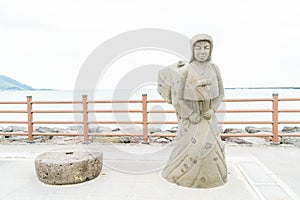 JEJU, KOREA - JULY 9, 2017: statue of Haenyeo at Hyeopjae Beach