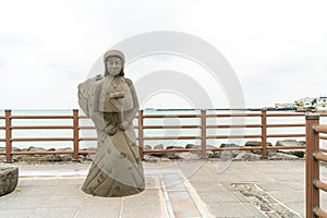 JEJU, KOREA - JULY 9, 2017: statue of Haenyeo at Hyeopjae Beach