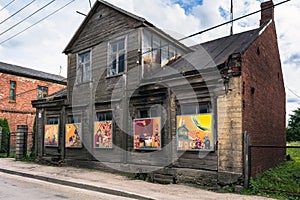 Old wooden building with colourful paintings instead of windows