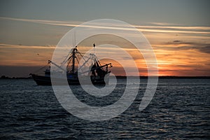 Shrimp boat at sunset off the Georgia Coast