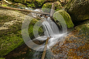 Jeleni waterfall in spring sunny cloudy day in Jizerske mountains