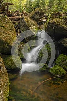 Jeleni waterfall in spring sunny cloudy day in Jizerske mountains