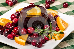 Jellied cranberry sauce with orange wedges