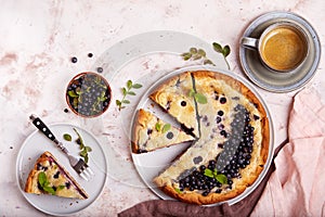 Jellied open pie tart with blueberry and cream filling. Top view