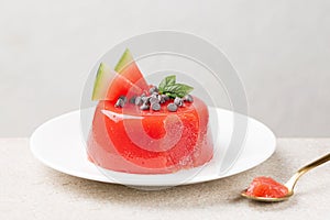 A jellied watermelon pudding, made with watermelon pulp, sugar and starch,