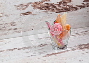 Jelly beans in a glass cup with copy space