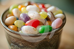 Jelly candy beans on a bowl. Close up view of candy beans with selective focus.