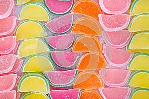 Jelly Marmalade Candies of Various Colors in Shape of Citrus Fruits Watermelon Wedges. Vivid Multicolored Palette Orange Yellow