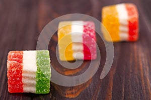 Jelly sweet, flavor fruit, candy dessert colorful on wood background