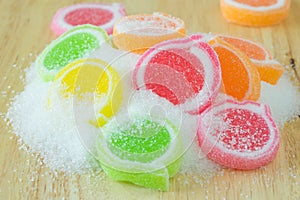 Jelly sweet, flavor fruit, candy dessert colorful on wood background.